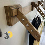 Load image into Gallery viewer, Sturdy wooden wall hanger with multiple slots for easy clothing organization.

