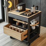 Load image into Gallery viewer, عربة قهوة أنيقة بتصميم خشبي معدني مع أدراج تخزين وعجلات، مثالية للمنازل والمكاتب الحديثة.
Modern wood and metal coffee cart with drawers and wheels — elegant, practical, and mobile.
